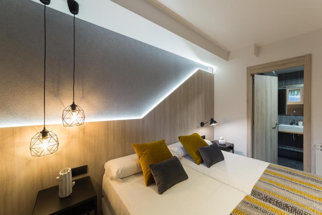 Postel nebo postele na pokoji v ubytování Hotel Onyarbi