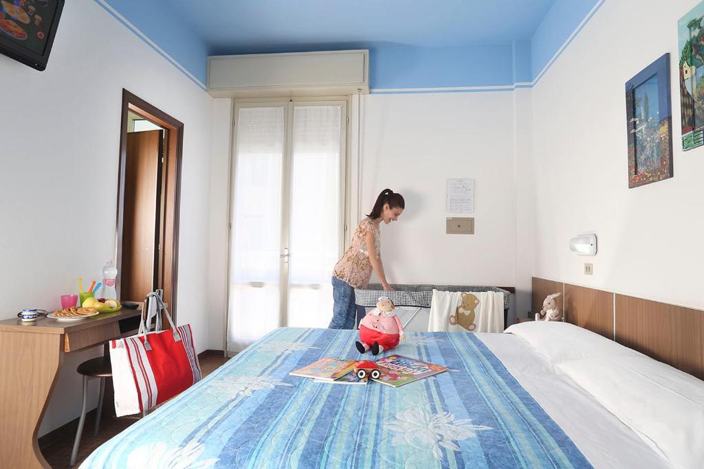 Postel nebo postele na pokoji v ubytování Hotel Marcus