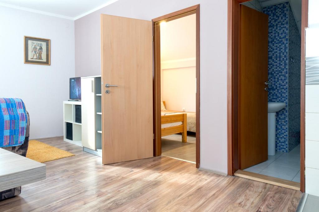 Postel nebo postele na pokoji v ubytování Athos Apartments