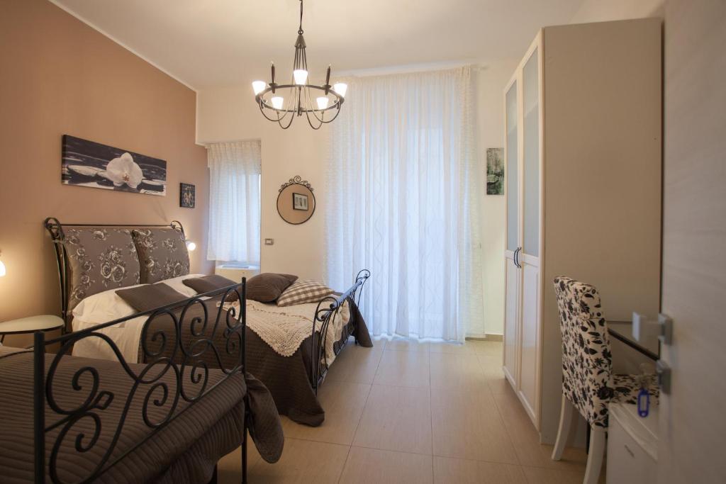 Postel nebo postele na pokoji v ubytování B&B Trio D'Archi - La Pilozza Infiorata