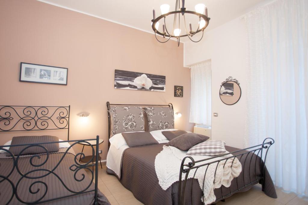 Postel nebo postele na pokoji v ubytování B&B Trio D'Archi - La Pilozza Infiorata