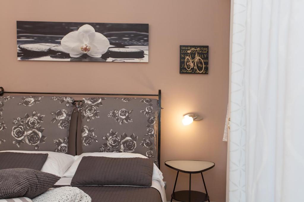 Postel nebo postele na pokoji v ubytování B&B Trio D'Archi - La Pilozza Infiorata
