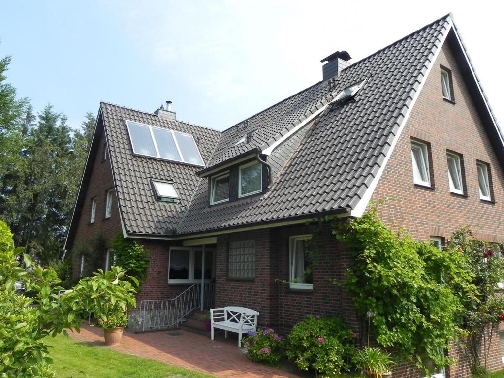 a house with a pitched roof with a window at Haus *Üüs Aran* Wohnung Nr. 3 in Nebel