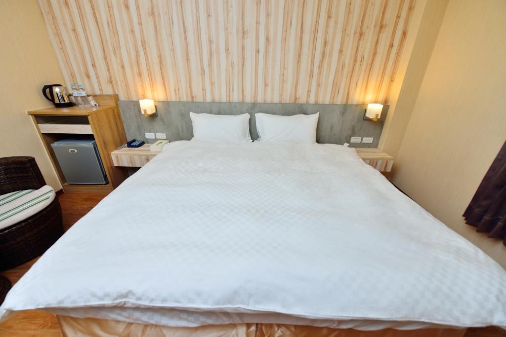 Voodi või voodid majutusasutuse Fu Yu Spring House toas