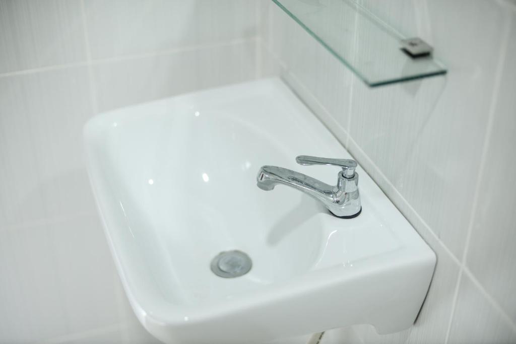 Koupelna v ubytování MG Hotel
