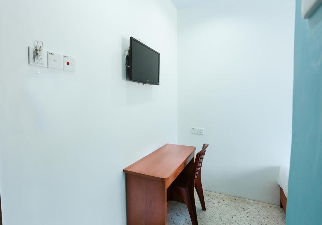 TV a/nebo společenská místnost v ubytování MG Hotel