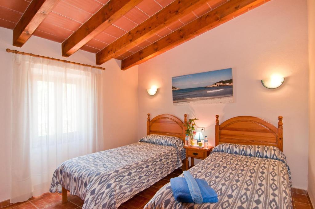 Postel nebo postele na pokoji v ubytování Finca Can Xet