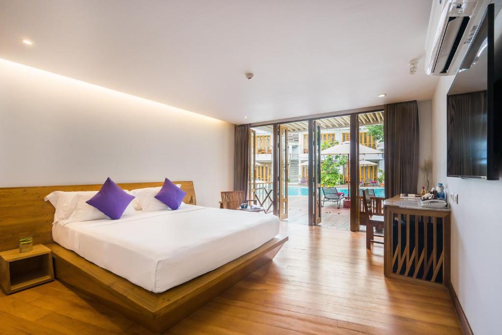 Postel nebo postele na pokoji v ubytování White Sand Samui Resort