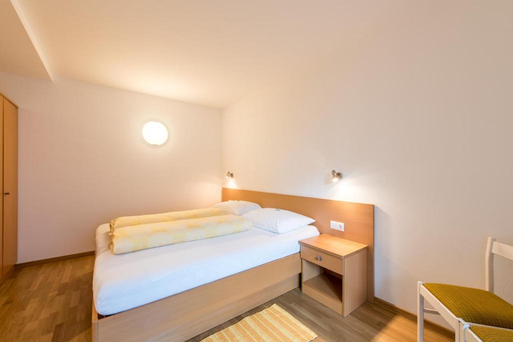 Postel nebo postele na pokoji v ubytování Haus Gufler