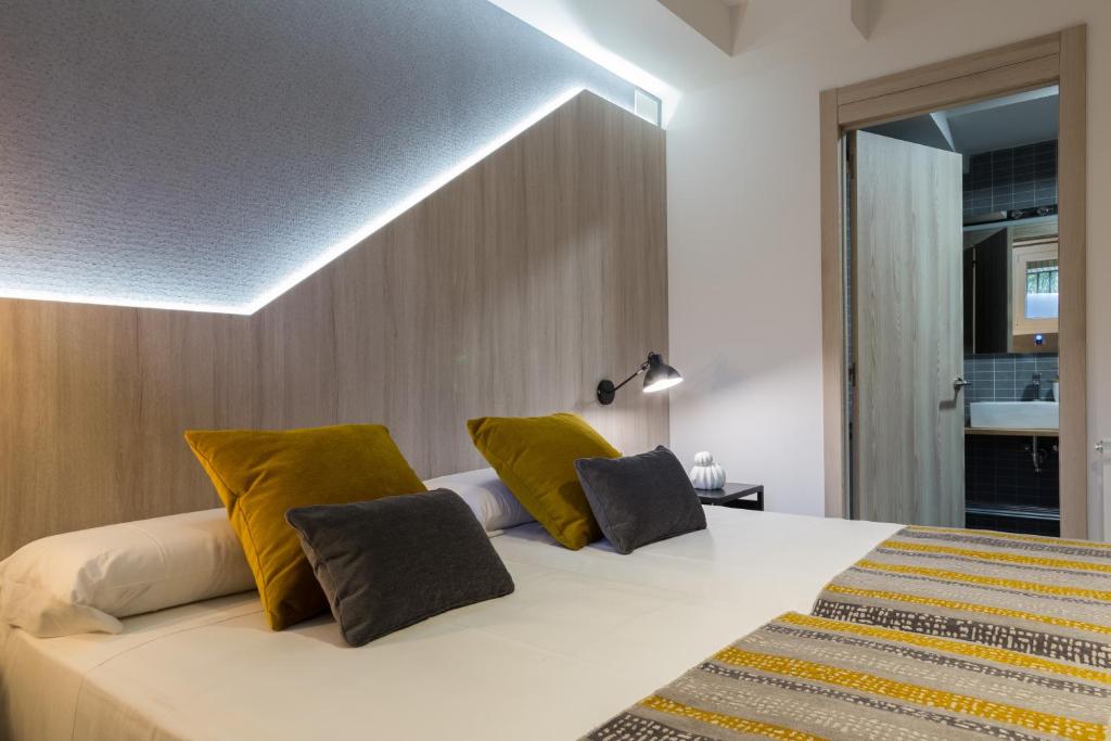Postel nebo postele na pokoji v ubytování Hotel Onyarbi