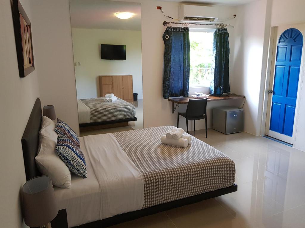 Postel nebo postele na pokoji v ubytování D´Gecko Hotel