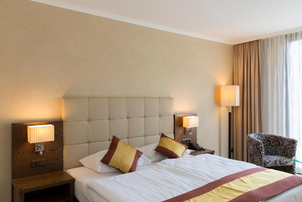 Postel nebo postele na pokoji v ubytování Hotel Sacher Baden