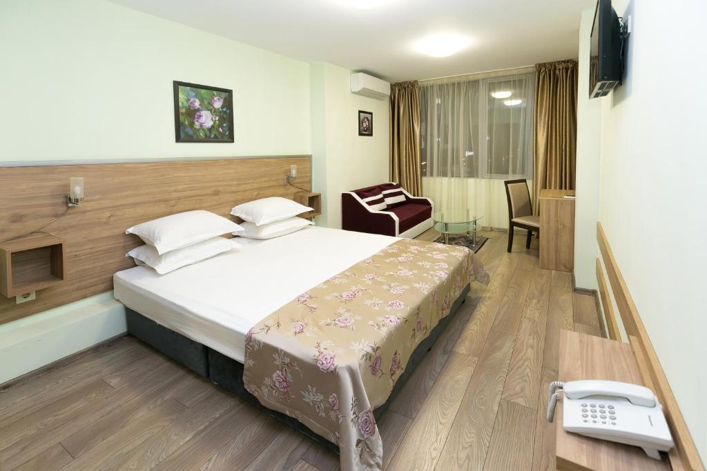 Postel nebo postele na pokoji v ubytování Hotel Gabi