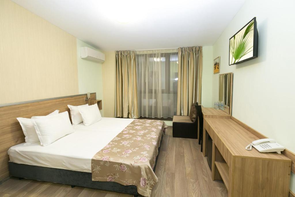 Postel nebo postele na pokoji v ubytování Hotel Gabi