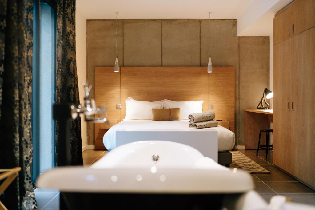 Postel nebo postele na pokoji v ubytování Citta di Lume Suites & Lofts