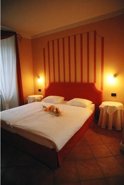 Łóżko lub łóżka w pokoju w obiekcie Hotel Casa Arizzoli