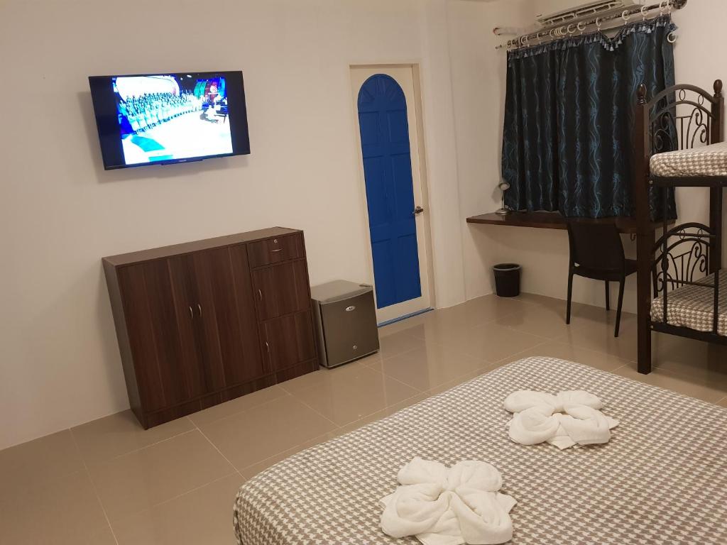 TV a/nebo společenská místnost v ubytování D´Gecko Hotel
