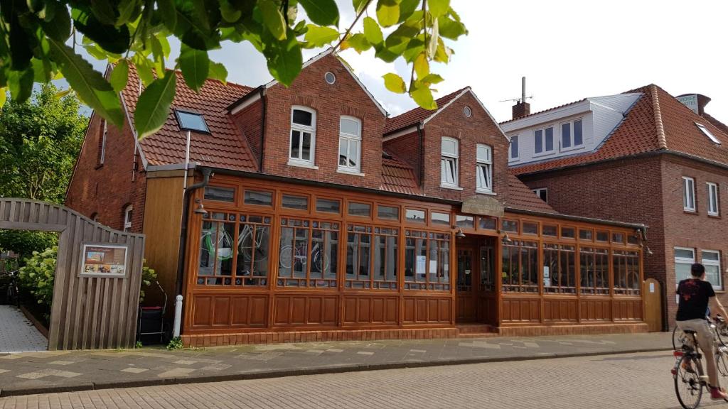 a building with a large woodenasteryasteryasteryasteryasteryasteryasteryasteryasteryastery at Fliegender Holländer in Juist