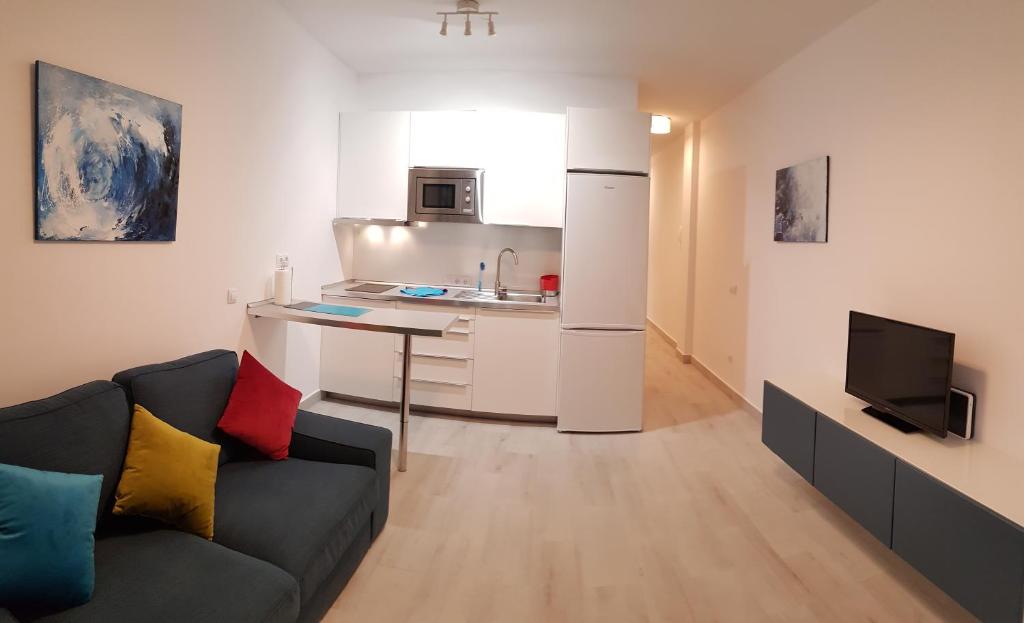 A kitchen or kitchenette at VV Canteras Sol y Playa