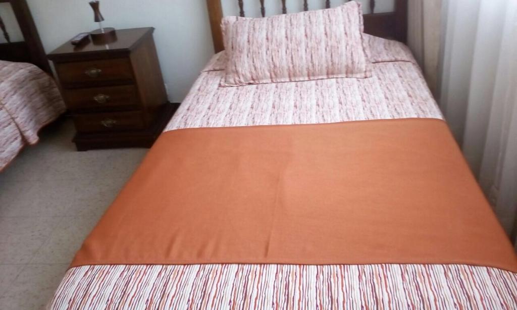 Postel nebo postele na pokoji v ubytování GHL casa hotel