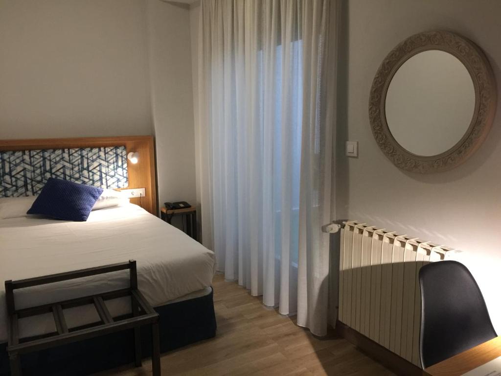 Posteľ alebo postele v izbe v ubytovaní Hotel Celanova