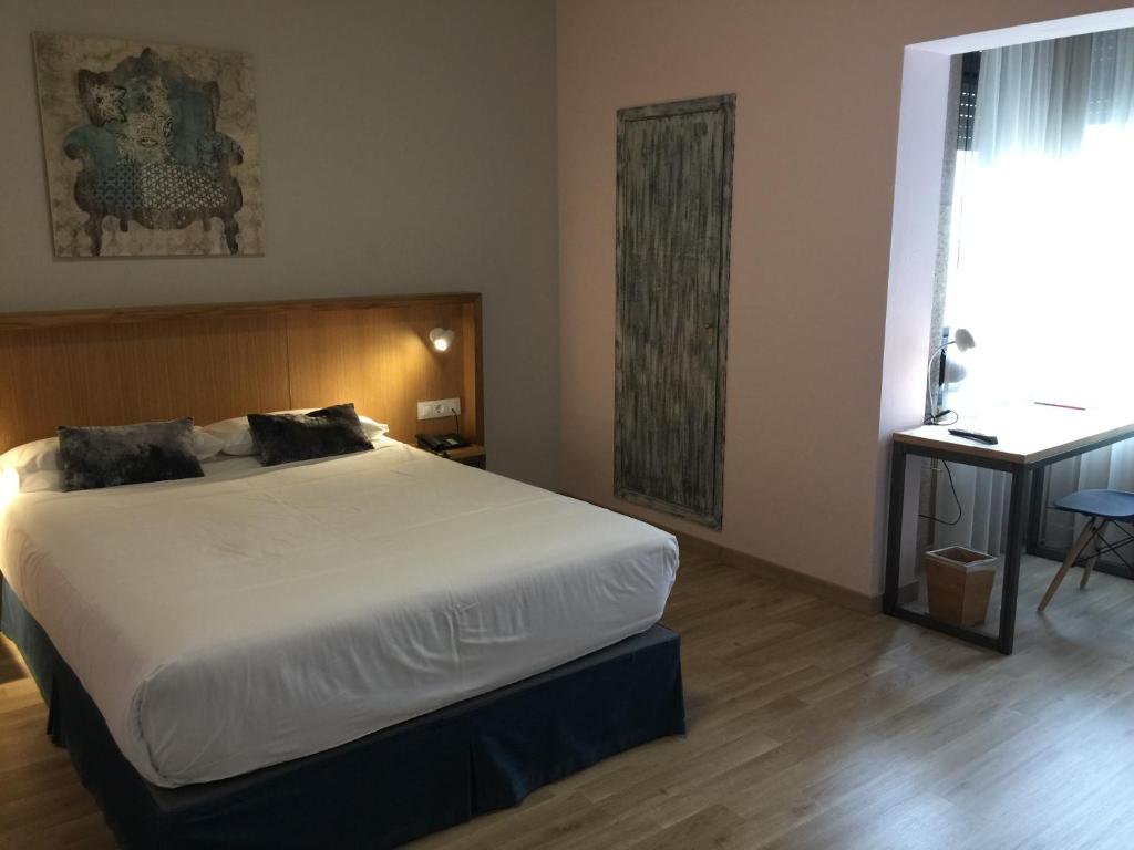 Posteľ alebo postele v izbe v ubytovaní Hotel Celanova