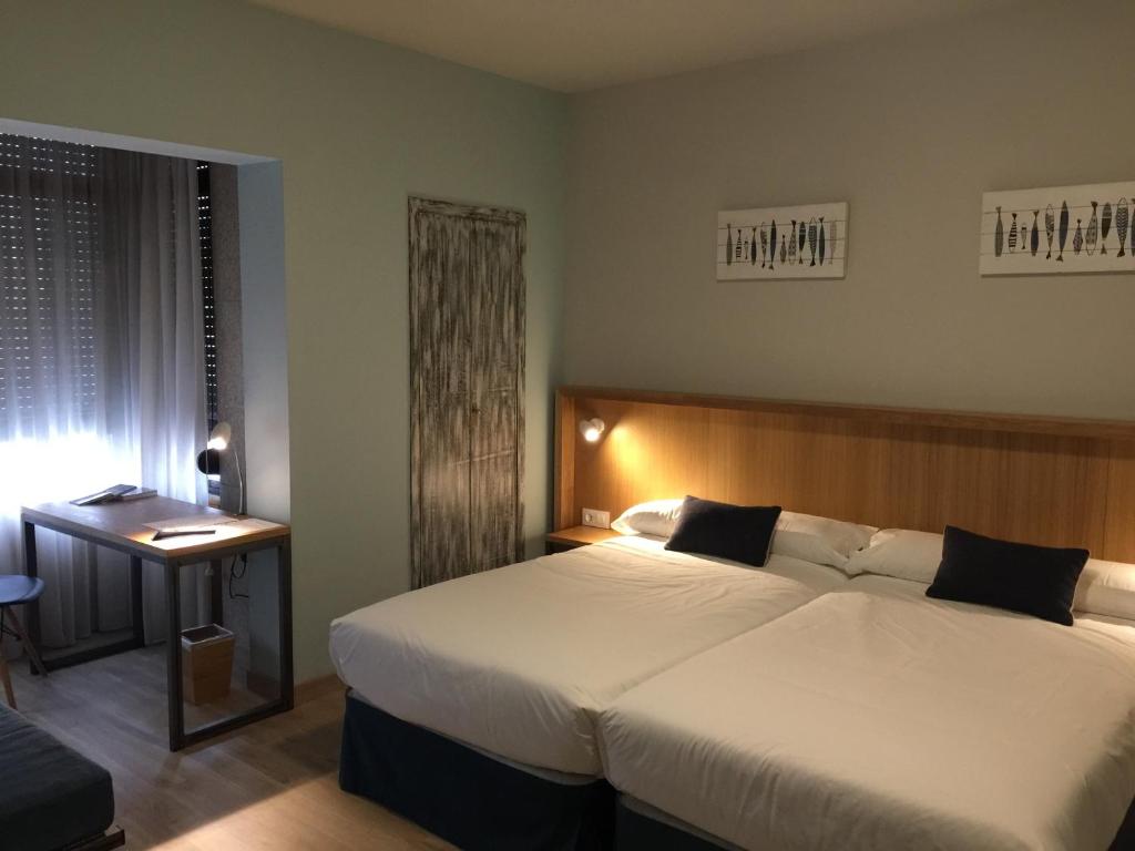 Posteľ alebo postele v izbe v ubytovaní Hotel Celanova