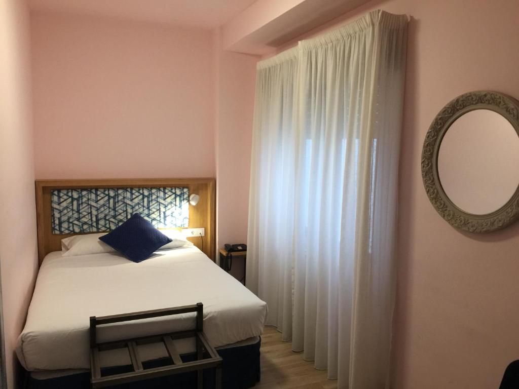 Posteľ alebo postele v izbe v ubytovaní Hotel Celanova