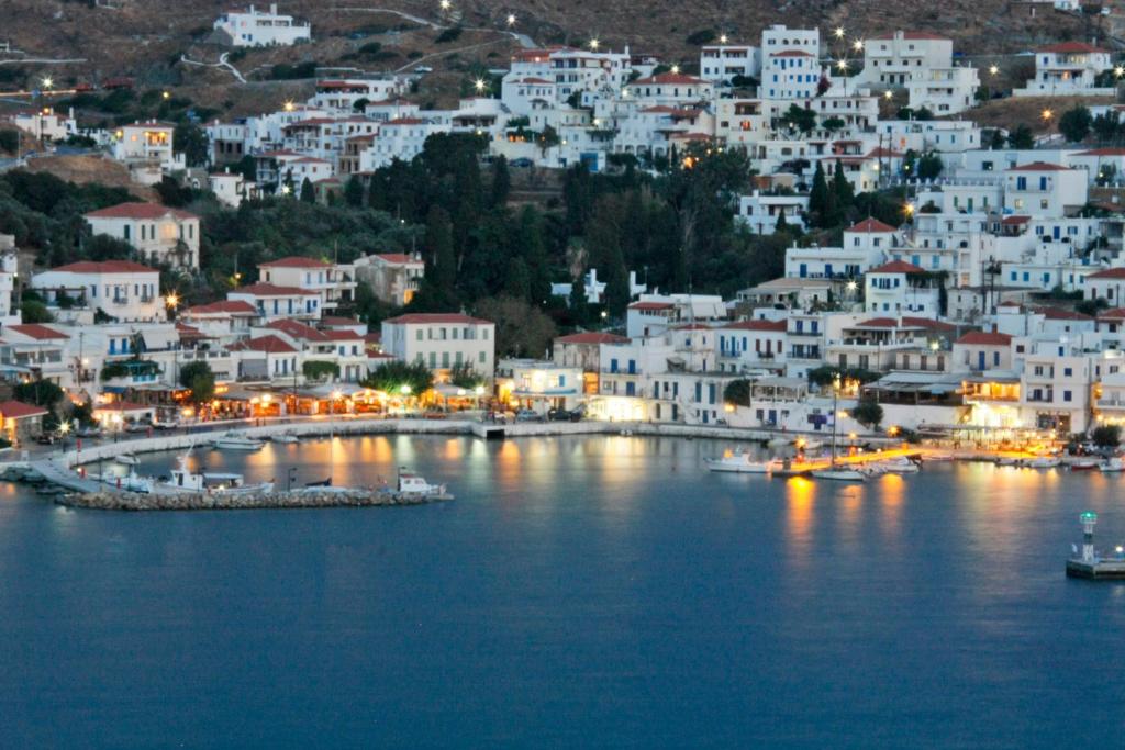 a view of a town with white buildings on the water at Mare Vista Hotel - Epaminondas in Batsi