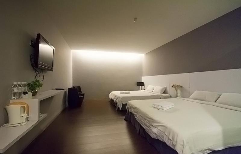 Postel nebo postele na pokoji v ubytování Chariton Hotel Ipoh