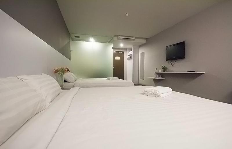 Postel nebo postele na pokoji v ubytování Chariton Hotel Ipoh