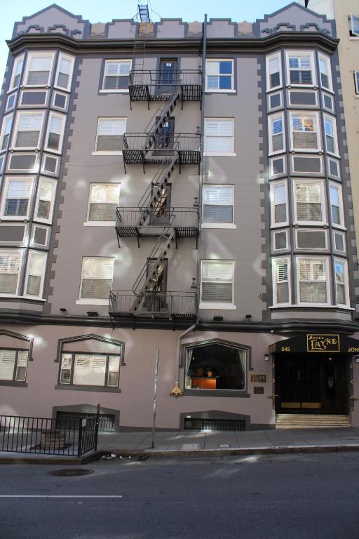 a tall building with fire escapes on the side of it at Layne Hotel in San Francisco