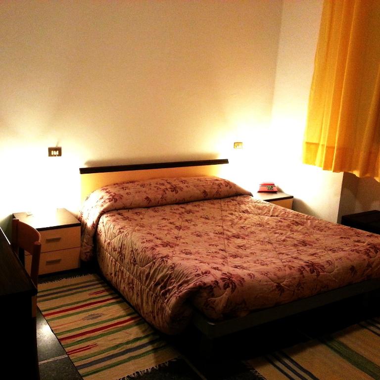 Postel nebo postele na pokoji v ubytování Hotel Mignon Posta
