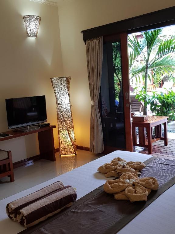 TV a/nebo společenská místnost v ubytování Senang Villa Gili Air