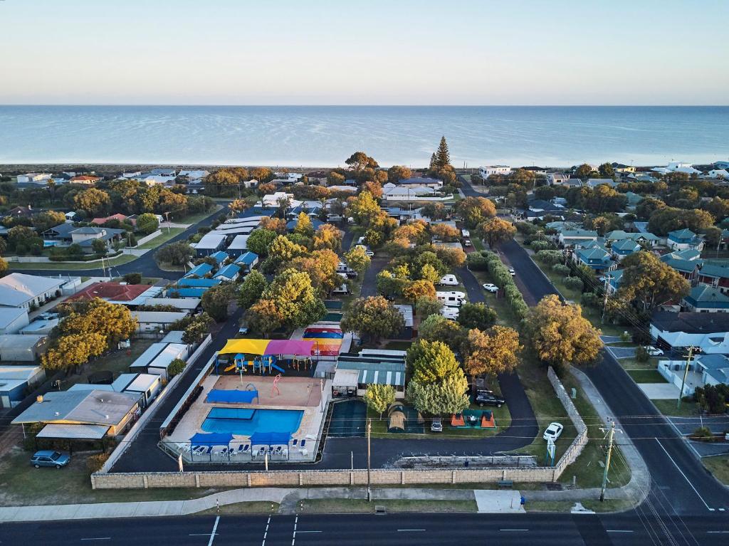 an aerial view of a parking lot next to the ocean at BIG4 Breeze Holiday Parks - Busselton in Busselton