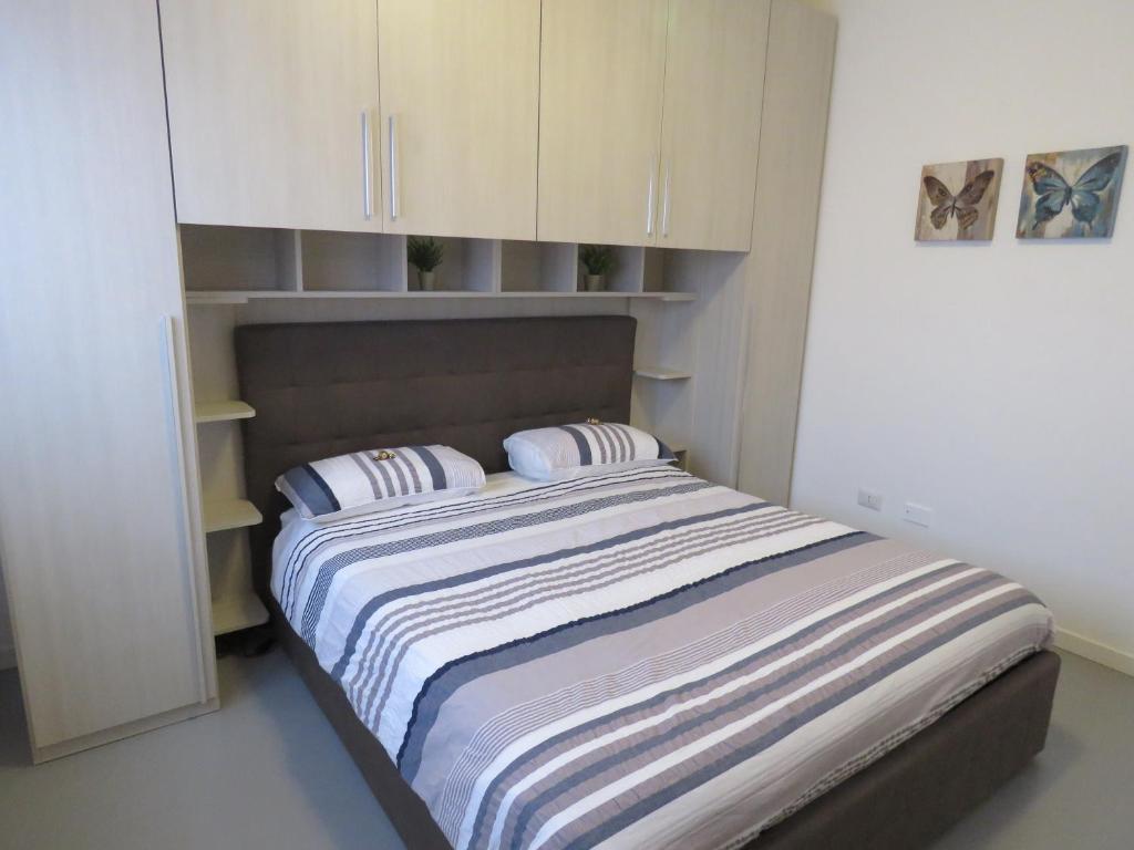 Postel nebo postele na pokoji v ubytování Assago Forum Apartment