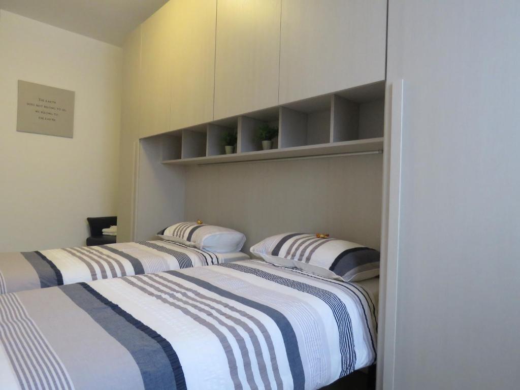 Postel nebo postele na pokoji v ubytování Assago Forum Apartment