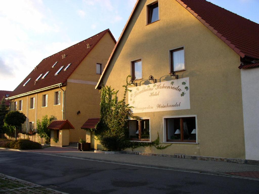 un edificio con un cartel en el costado en Landhaus Hohenroda en Hohenroda