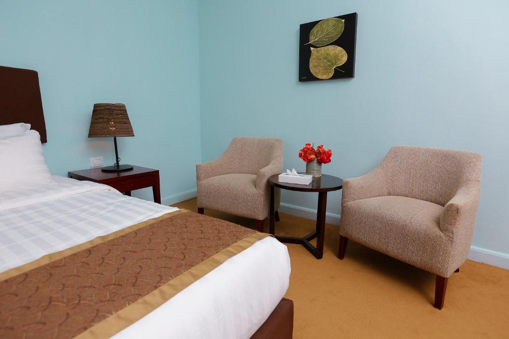 Postel nebo postele na pokoji v ubytování Tolip Family Park Hotel