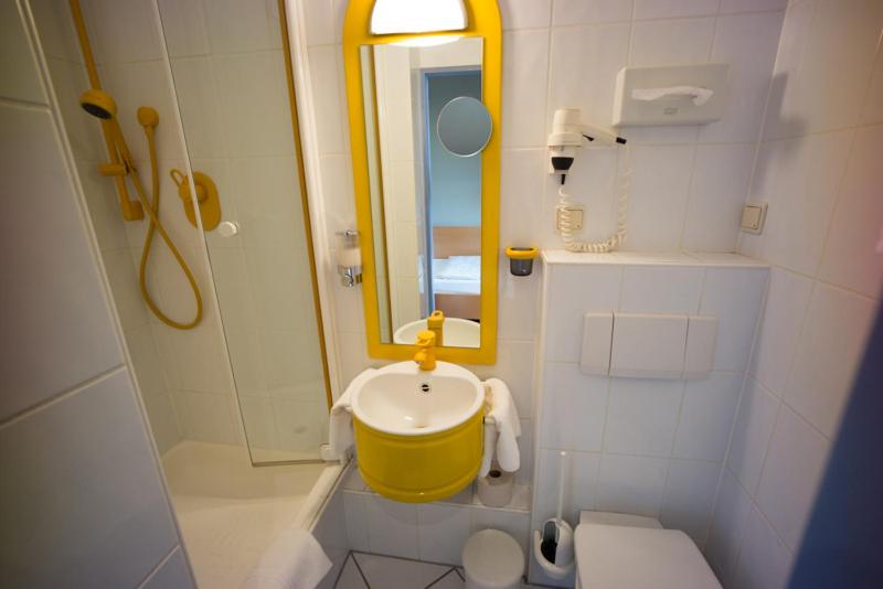 Koupelna v ubytování Hotel Gude