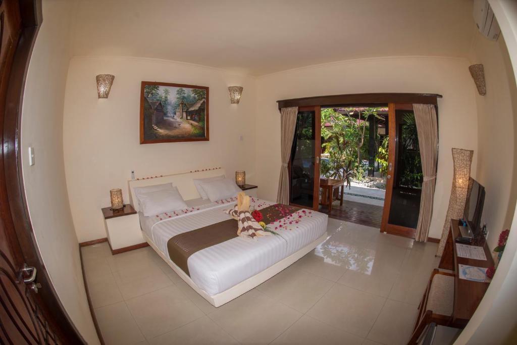 Postel nebo postele na pokoji v ubytování Senang Villa Gili Air