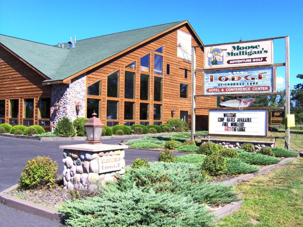 a lodge with a sign in front of a building at The Lodge at Crooked Lake in Siren