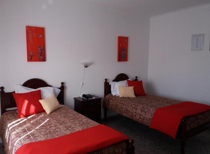 Postel nebo postele na pokoji v ubytování Hotel Branco II