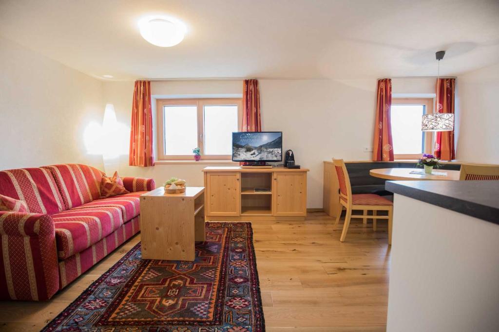 TV a/nebo společenská místnost v ubytování Caroline's Appartement