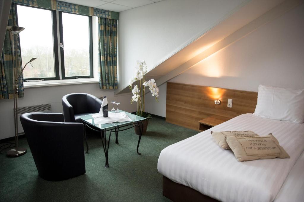 Postel nebo postele na pokoji v ubytování Fletcher Hotel Restaurant Heidehof