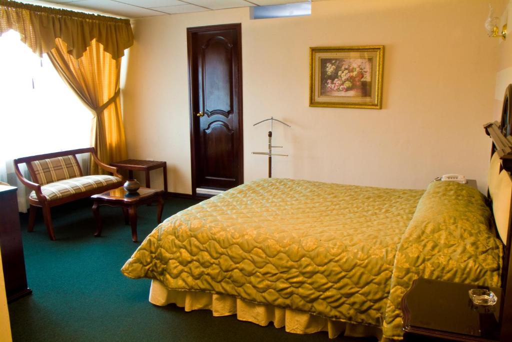 Postel nebo postele na pokoji v ubytování Hotel Podocarpus