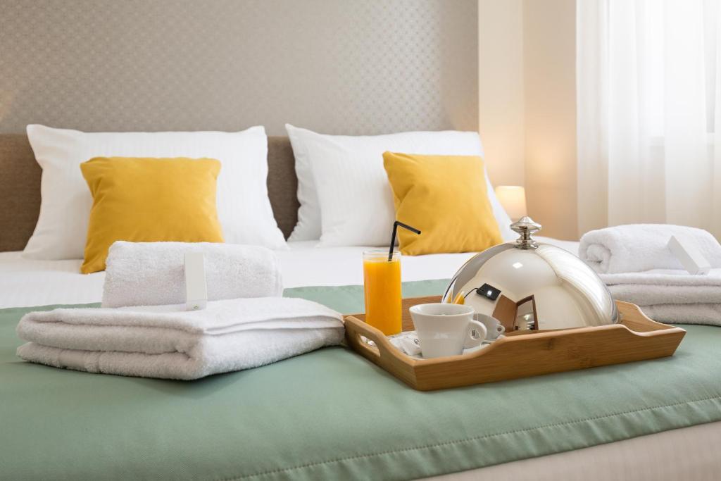 Postel nebo postele na pokoji v ubytování Prime Hotel Apartmani