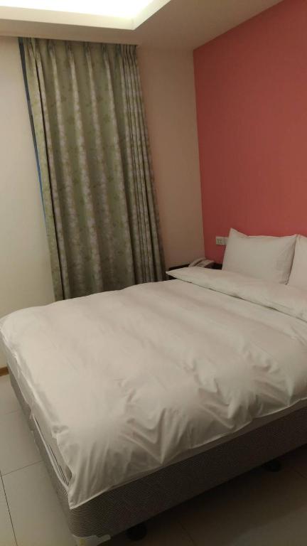Postel nebo postele na pokoji v ubytování Galaxy Mini Inn
