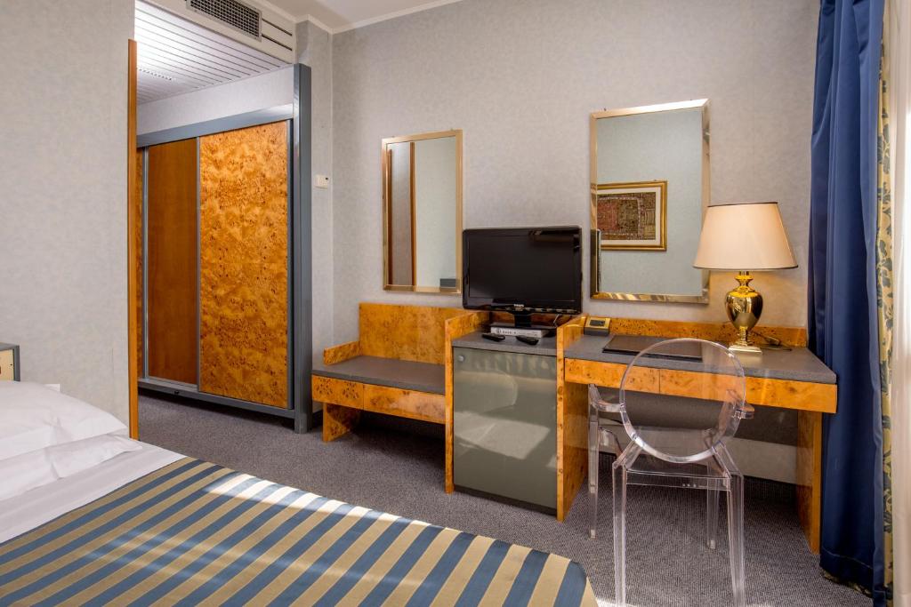 TV a/nebo společenská místnost v ubytování Enea Hotel Pomezia