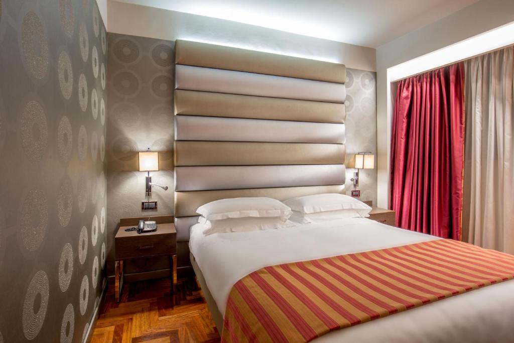 Postel nebo postele na pokoji v ubytování Enea Hotel Pomezia